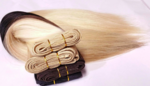 Two wefts each of blond and dark brown hair.